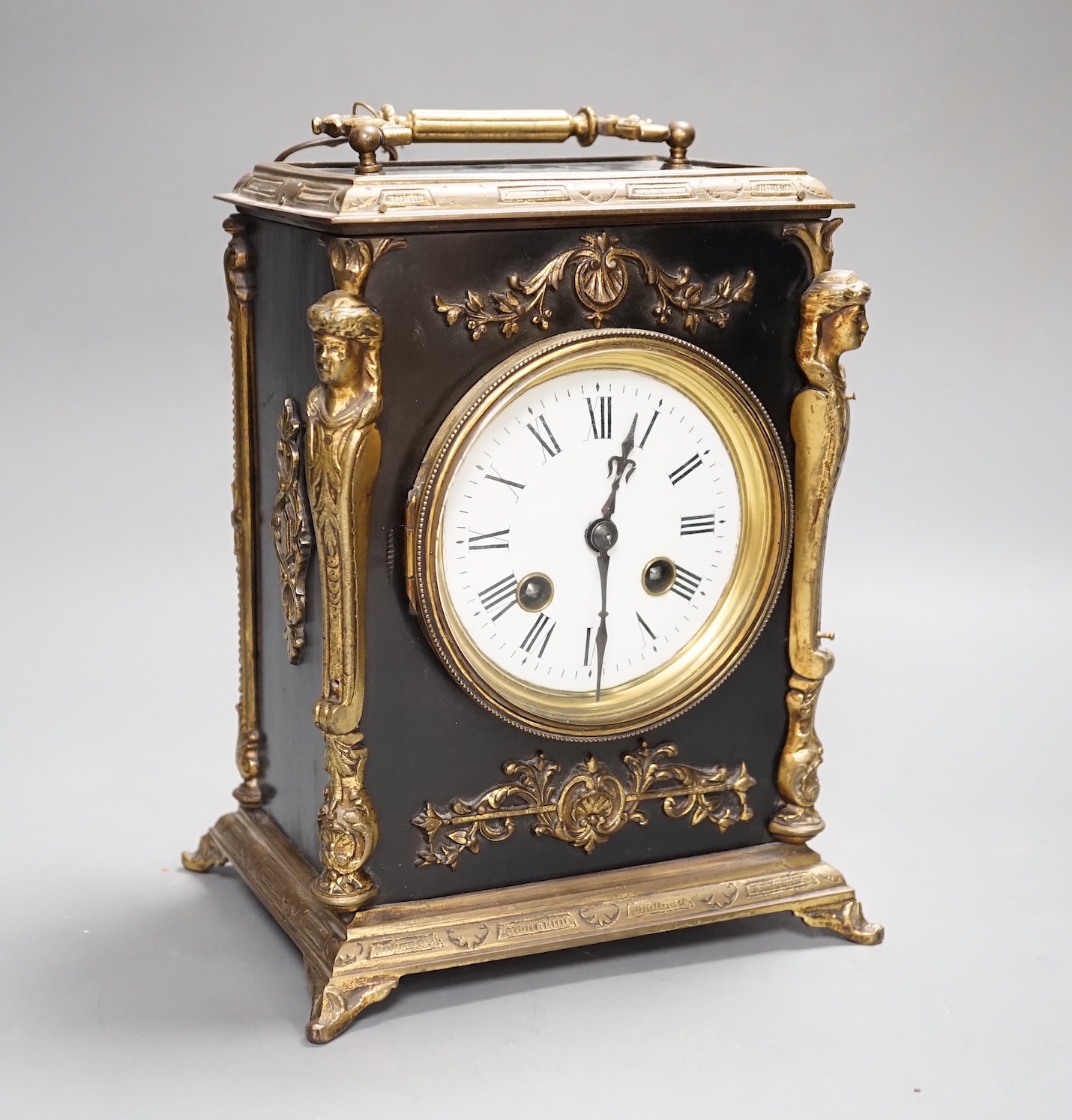 A 19th century brass and ebonised mantel clock